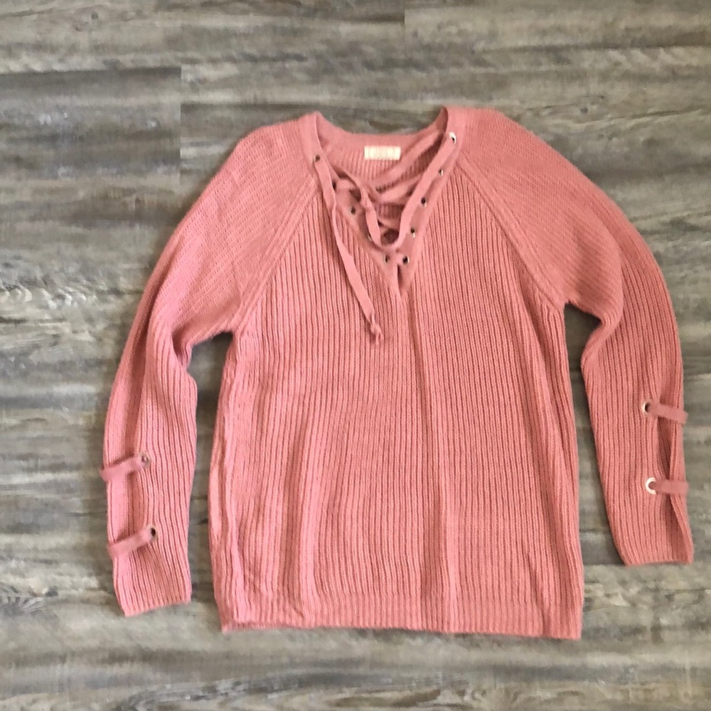 Sweater with lace up details